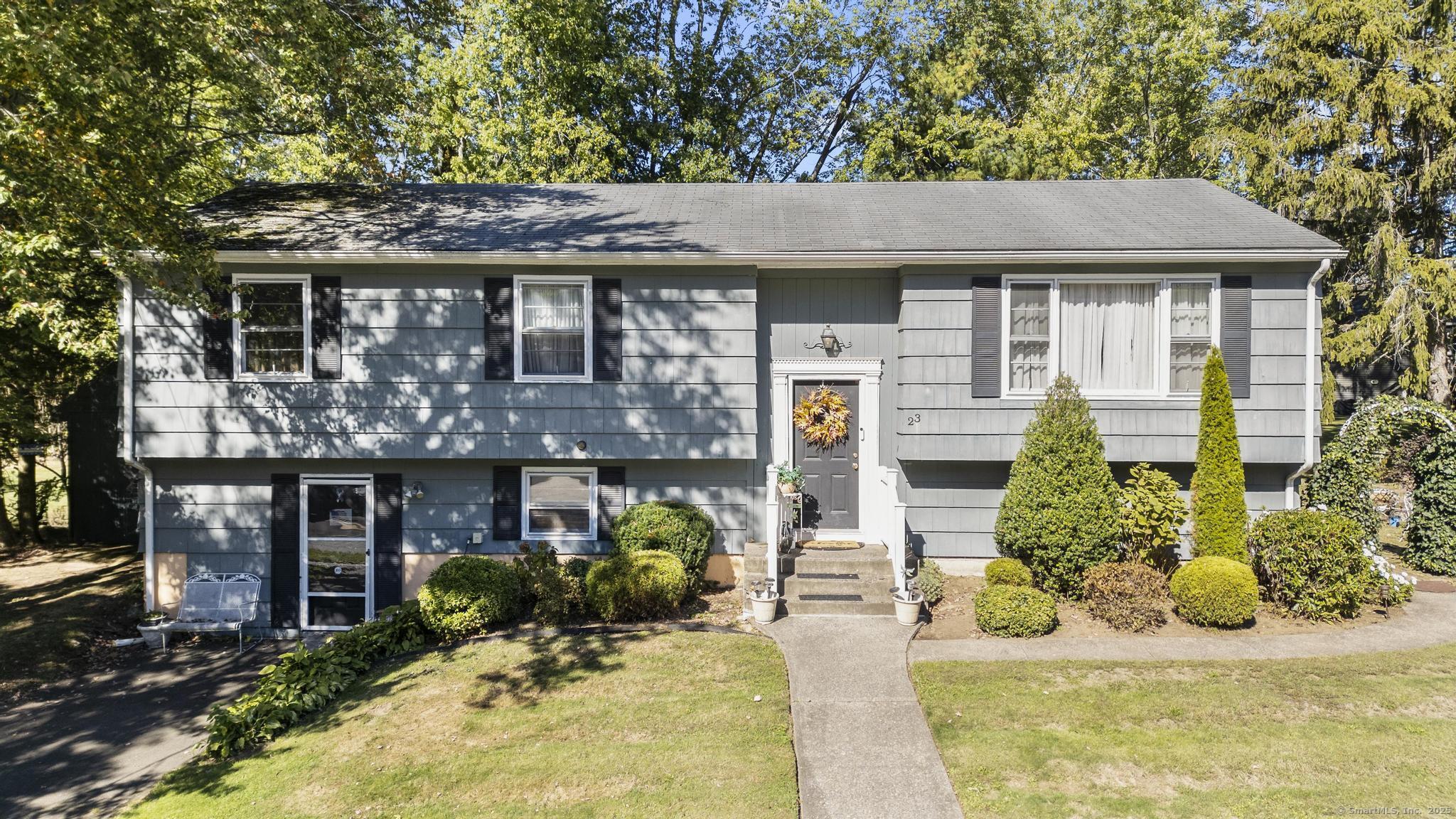 a front view of a house with a yard and porch