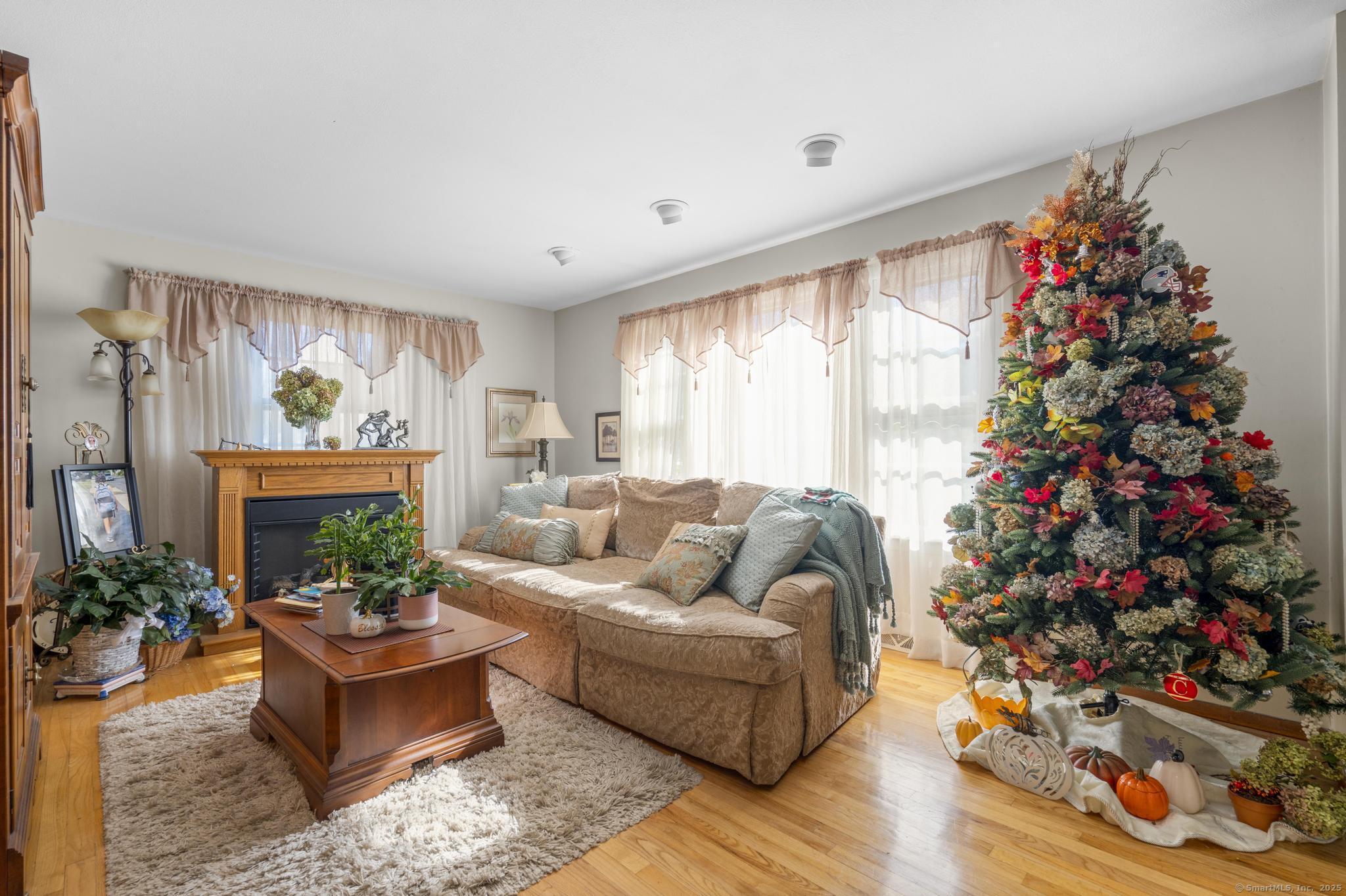 23 Meadow Brook Road West Haven, CT 06516 - Photo 12 of 39 a living room with furniture and a large window