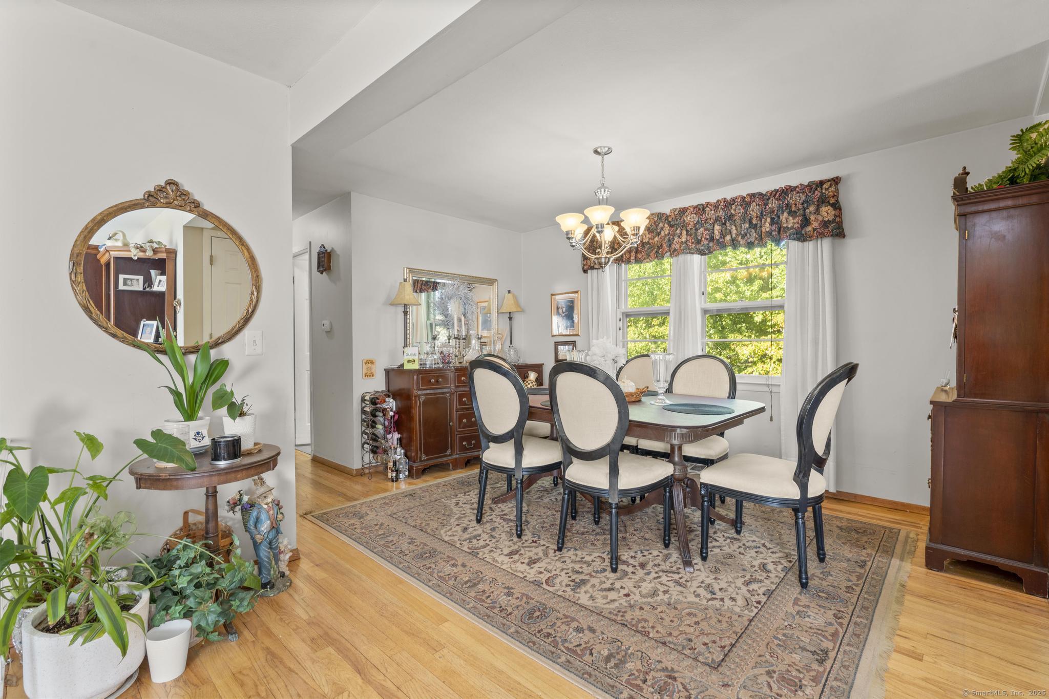 23 Meadow Brook Road West Haven, CT 06516 - Photo 15 of 39 a view of a dining room with furniture window and wooden floor
