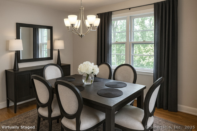 23 Meadow Brook Road West Haven, CT 06516 - Photo 16 of 39 a view of a dining room with furniture wooden floor and chandelier