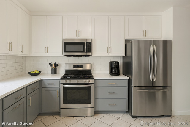 23 Meadow Brook Road West Haven, CT 06516 - Photo 19 of 39 a kitchen with cabinets stainless steel appliances and a sink