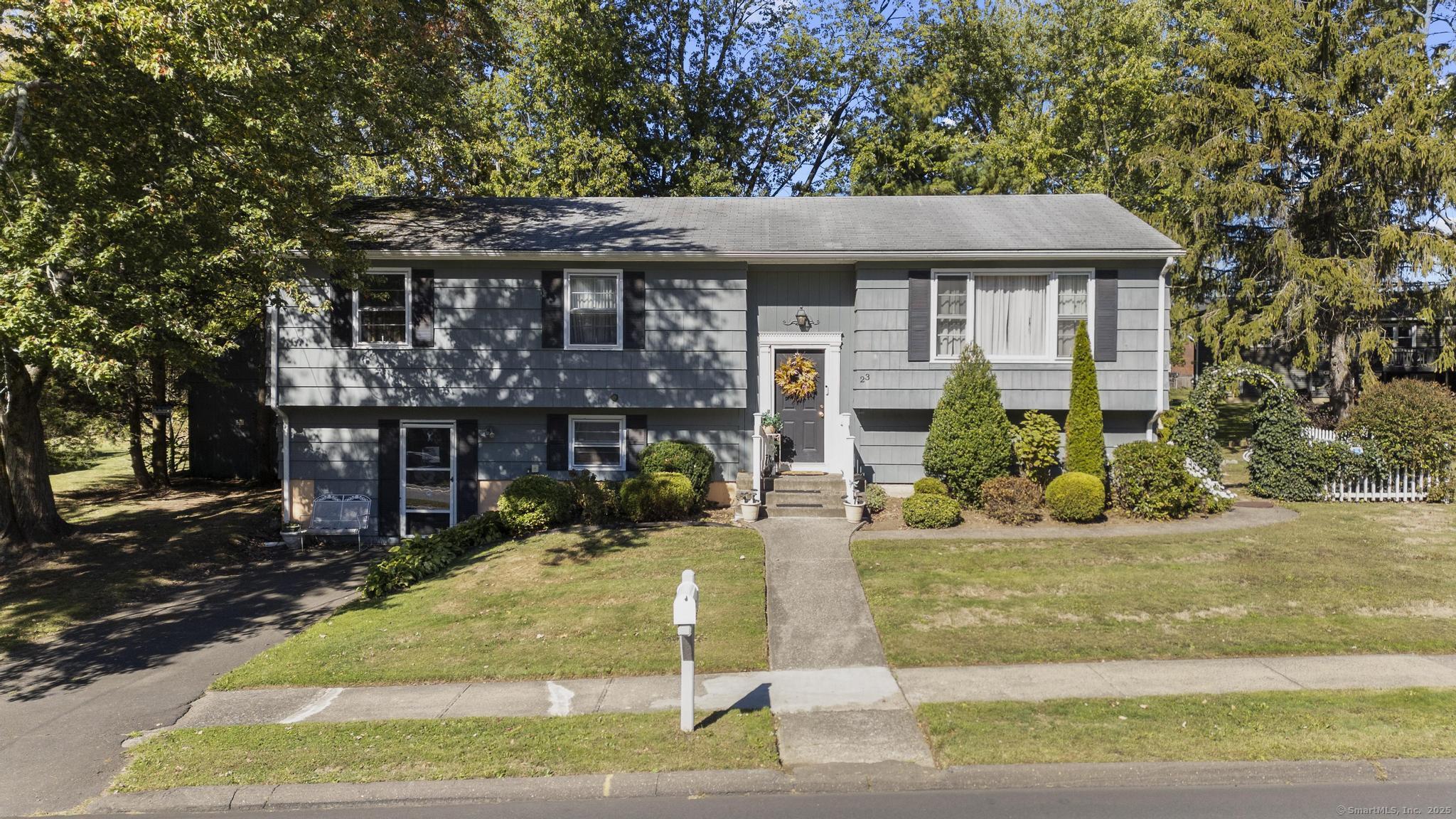 23 Meadow Brook Road West Haven, CT 06516 - Photo 2 of 39 a view of a house with potted plants