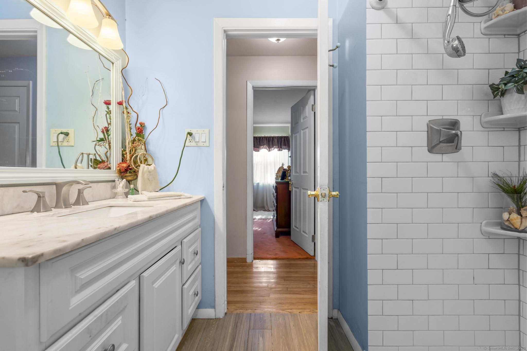 23 Meadow Brook Road West Haven, CT 06516 - Photo 23 of 39 a en suite bathroom with a sink and mirror