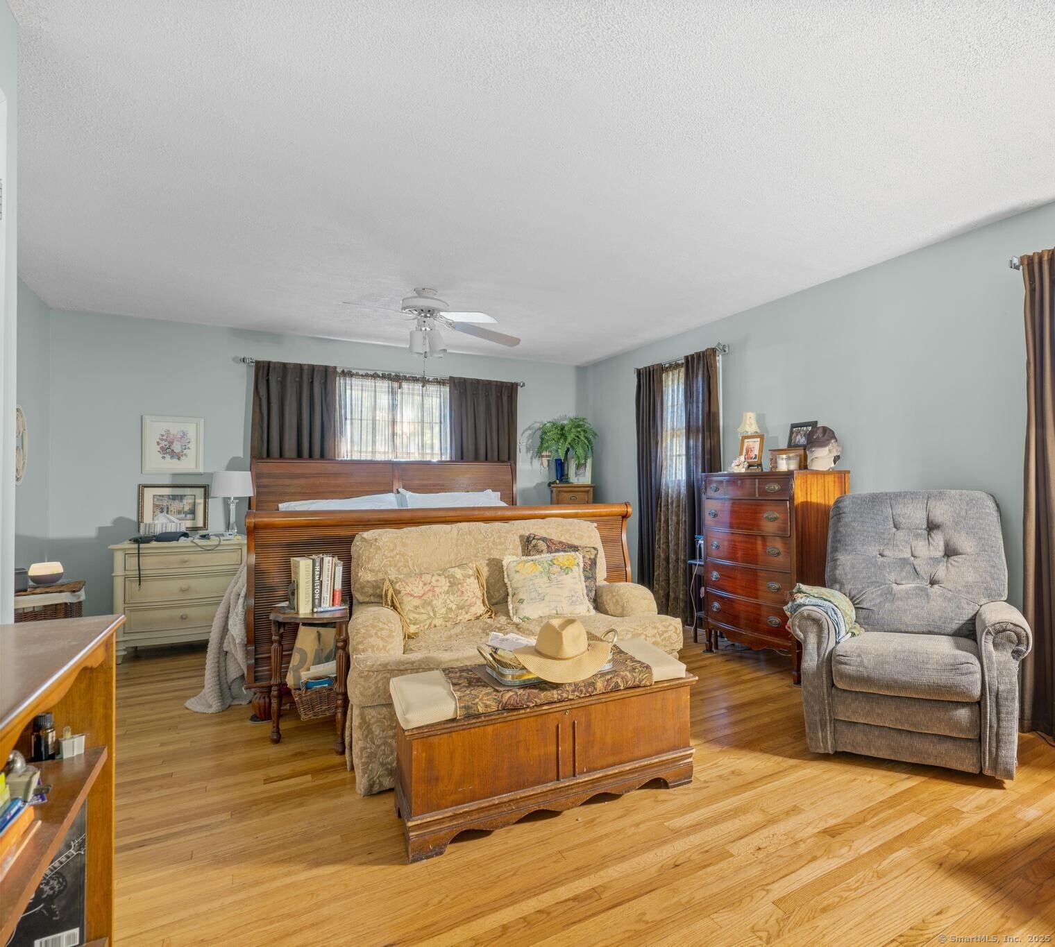23 Meadow Brook Road West Haven, CT 06516 - Photo 26 of 39 a bedroom with furniture and wooden floor