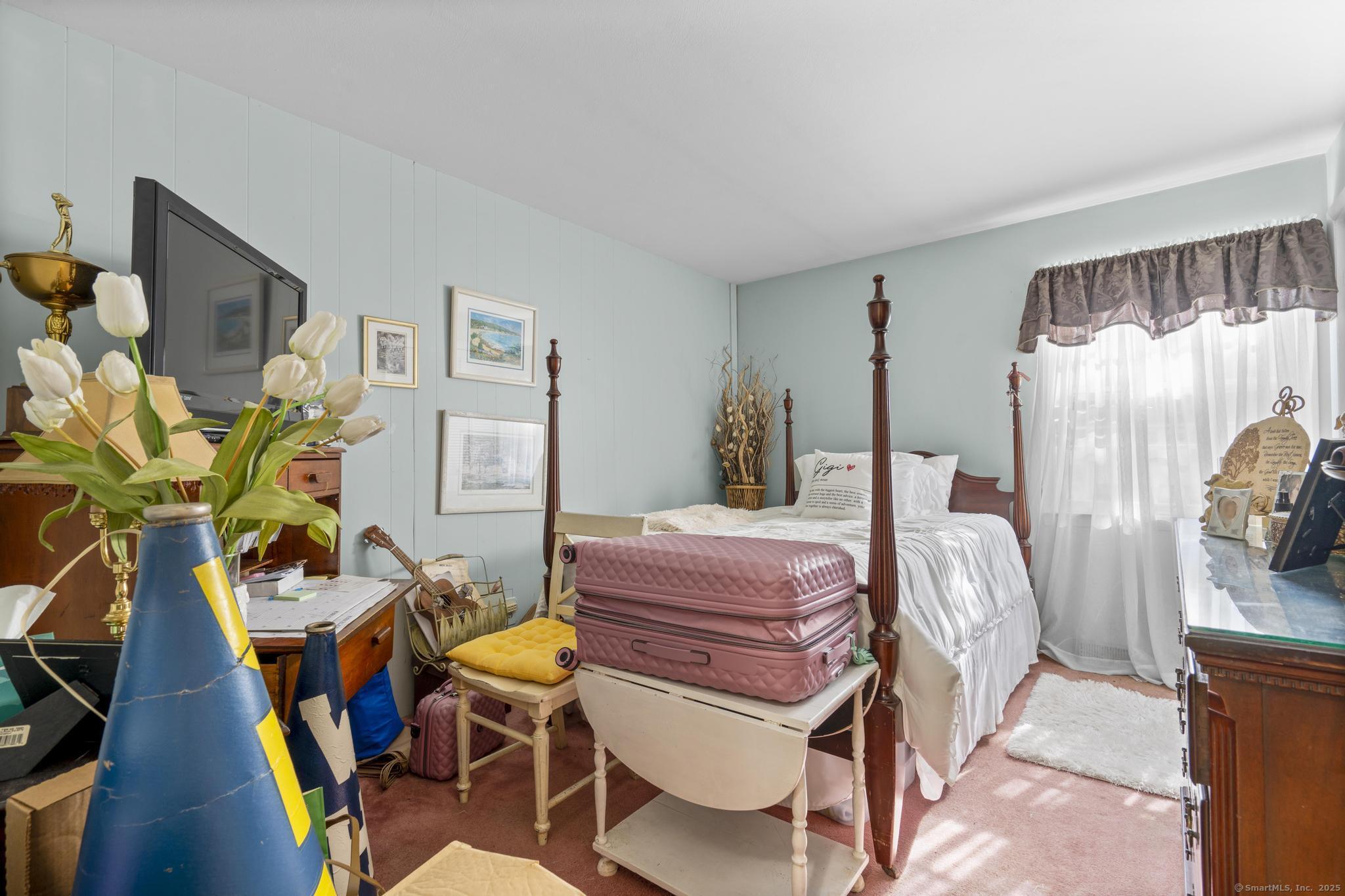 23 Meadow Brook Road West Haven, CT 06516 - Photo 29 of 39 a bedroom with furniture and a wooden floor