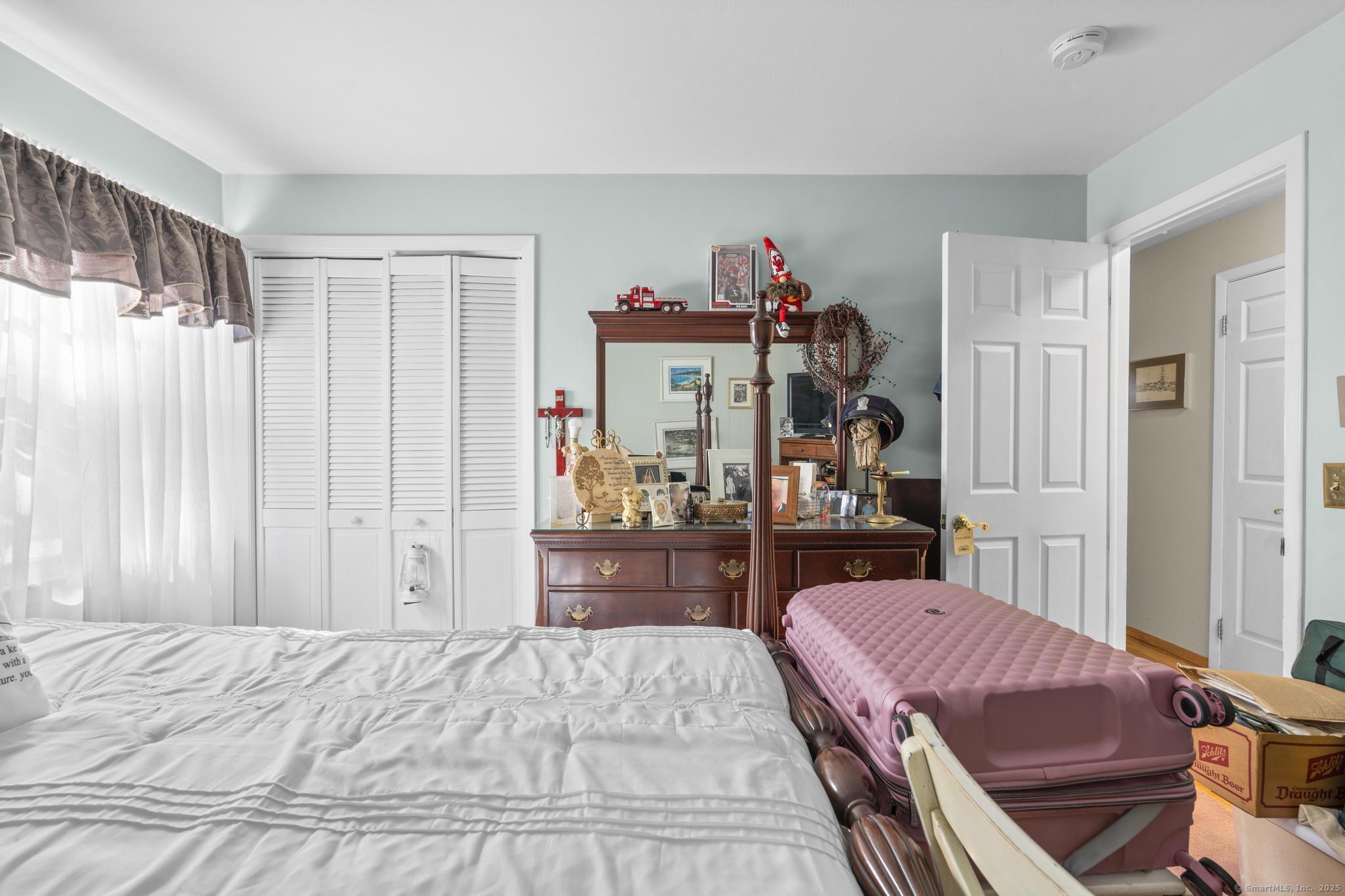 23 Meadow Brook Road West Haven, CT 06516 - Photo 30 of 39 a bed room with a bed and a closet