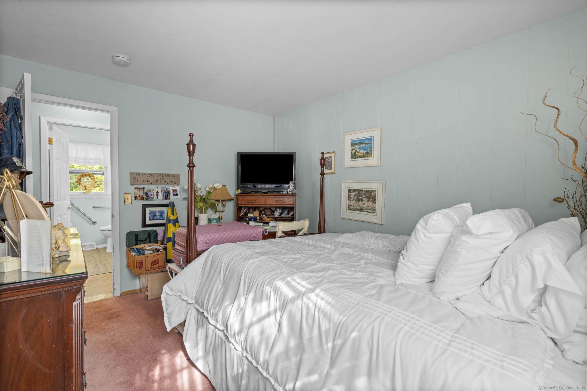 23 Meadow Brook Road West Haven, CT 06516 - Photo 31 of 39 a bedroom with a bed and a flat screen tv