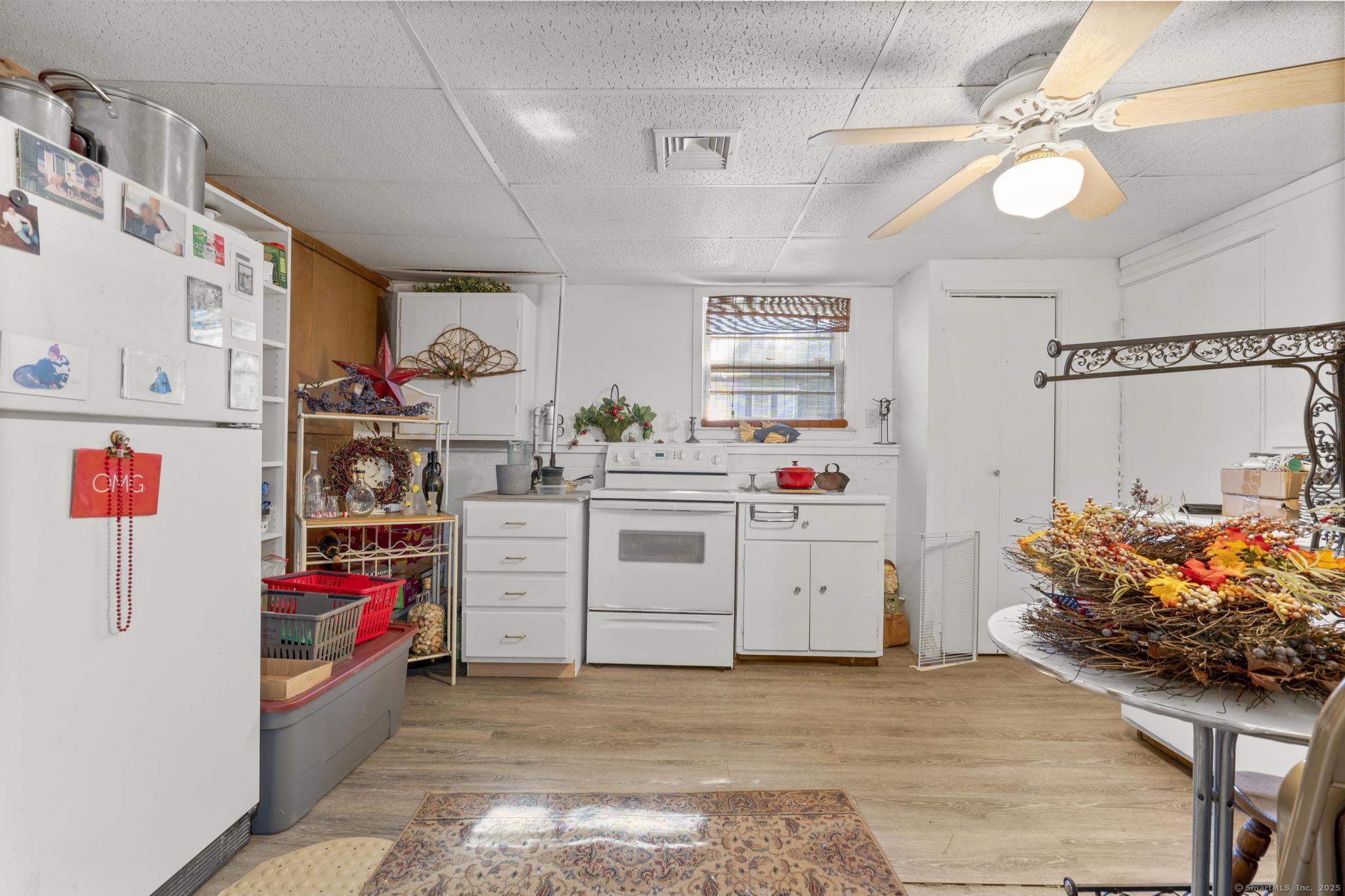 23 Meadow Brook Road West Haven, CT 06516 - Photo 32 of 39 a utility room with cabinets dryer and washer