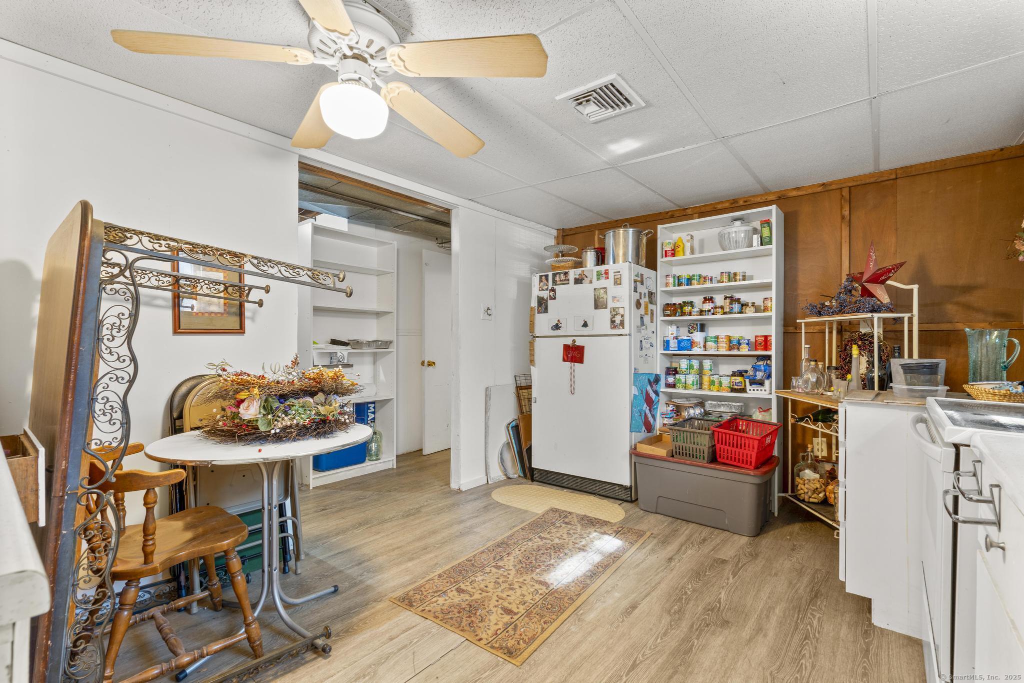 23 Meadow Brook Road West Haven, CT 06516 - Photo 33 of 39 a living room with furniture and a flat screen tv