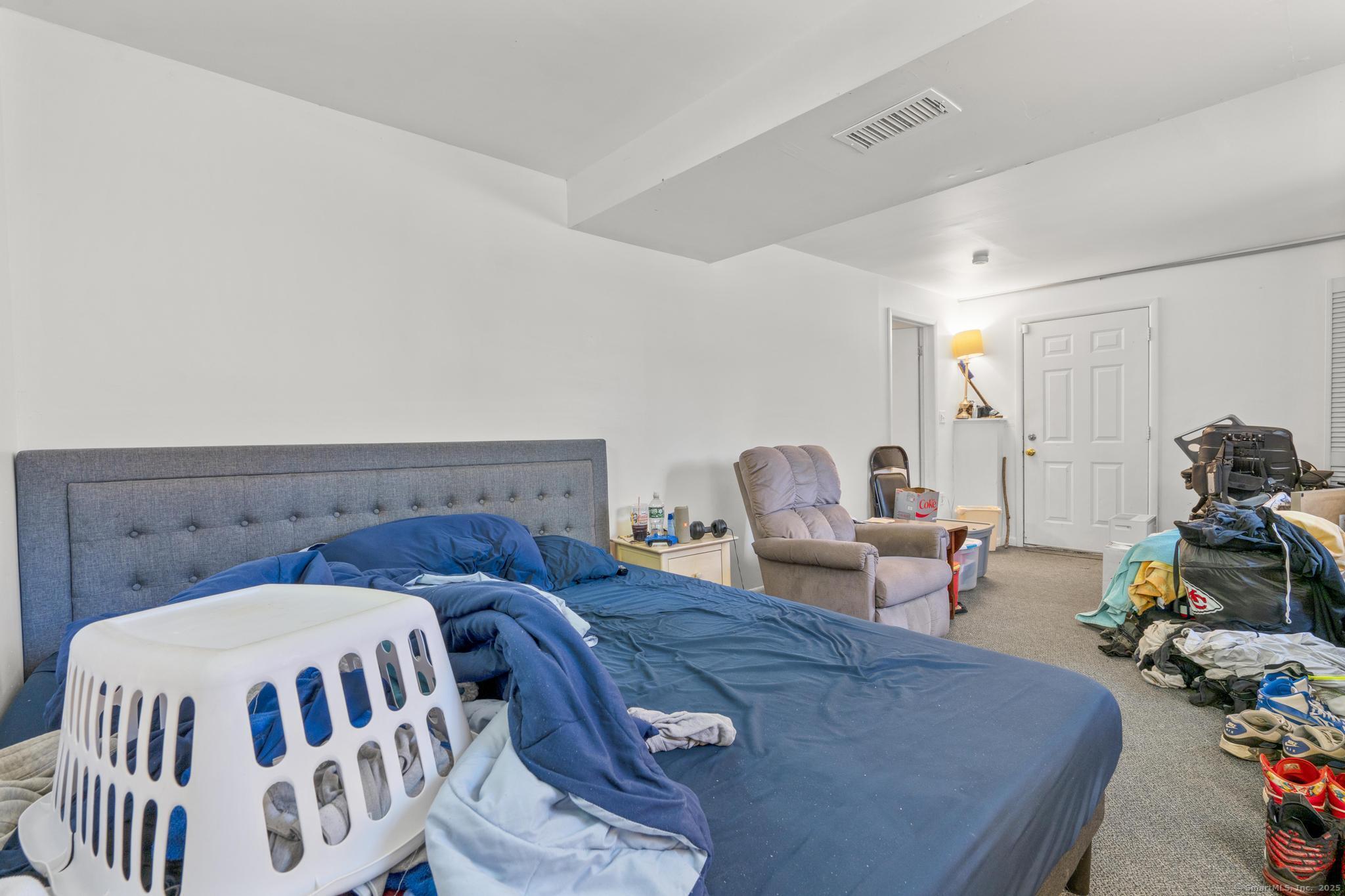 23 Meadow Brook Road West Haven, CT 06516 - Photo 35 of 39 a living room with furniture and a couch