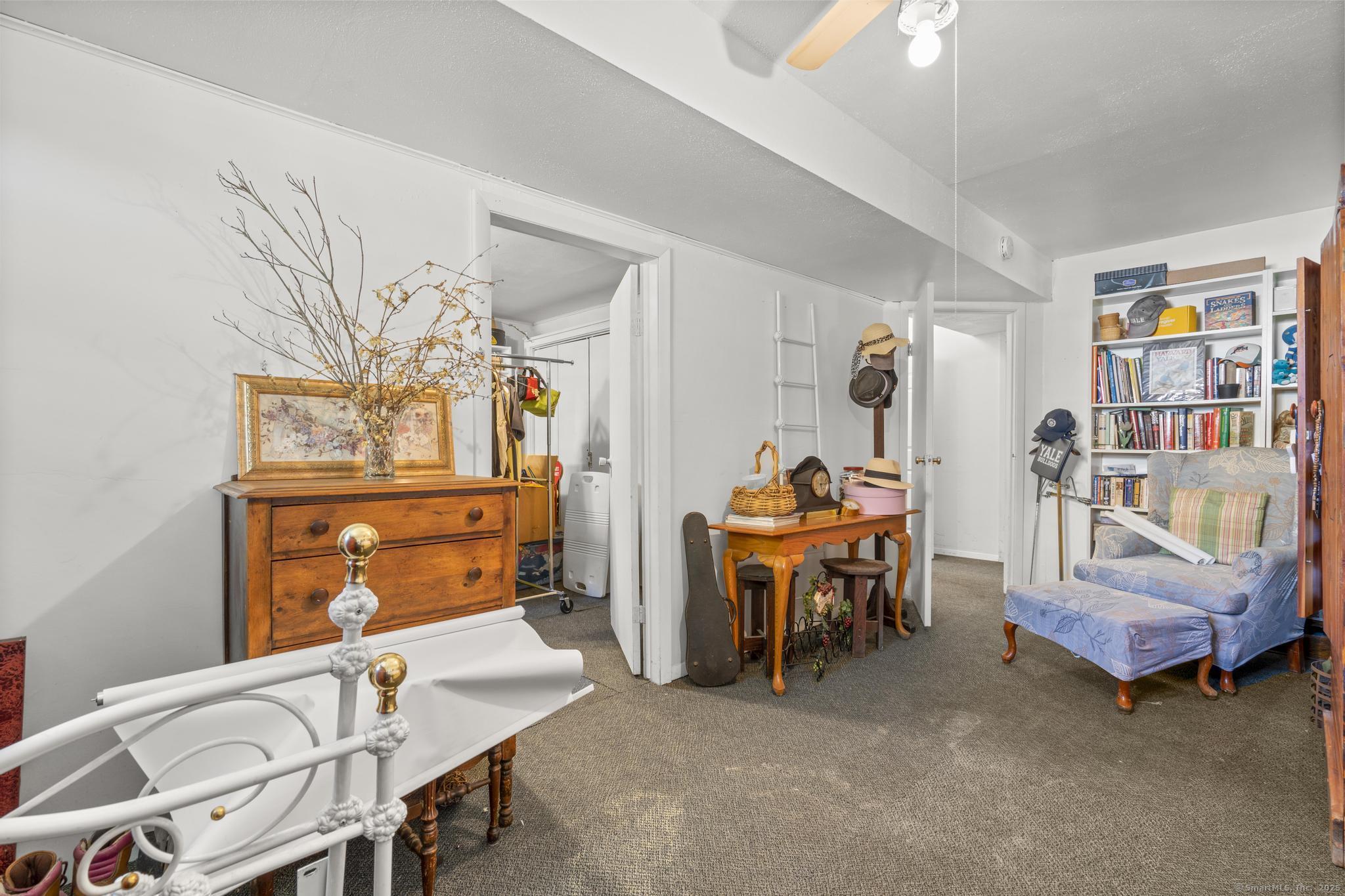 23 Meadow Brook Road West Haven, CT 06516 - Photo 37 of 39 a living room with furniture and a baby crib