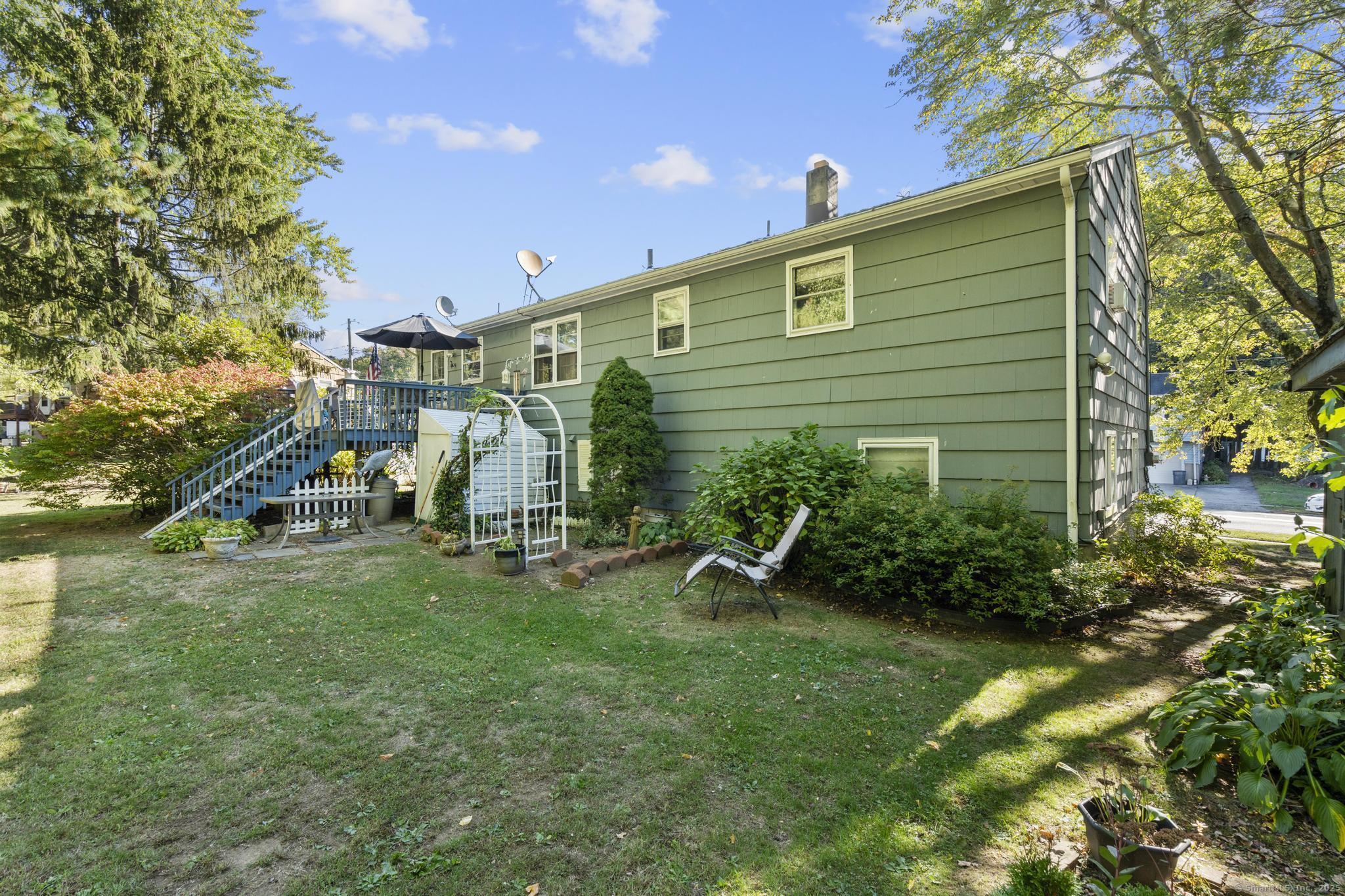 23 Meadow Brook Road West Haven, CT 06516 - Photo 7 of 39 a view of a backyard with plants and a patio