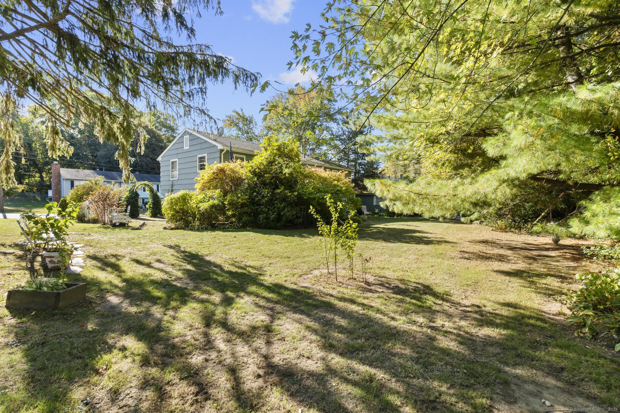 23 Meadow Brook Road West Haven, CT 06516 - Photo 8 of 39 a view of yard with trees