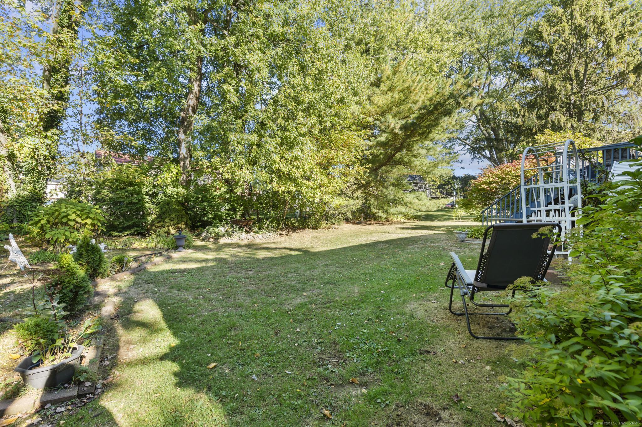 23 Meadow Brook Road West Haven, CT 06516 - Photo 9 of 39 a view of a garden with a bench