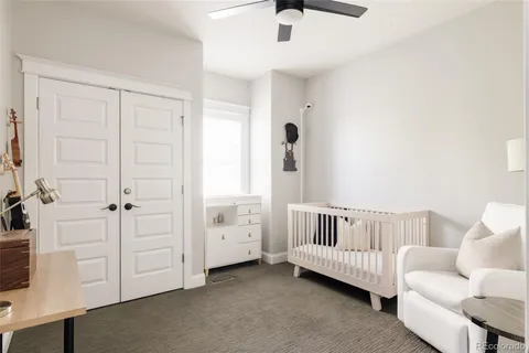 a bedroom with furniture and wooden floor