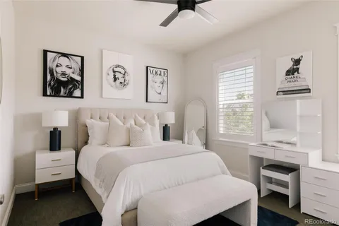 a bedroom with a bed and a desk