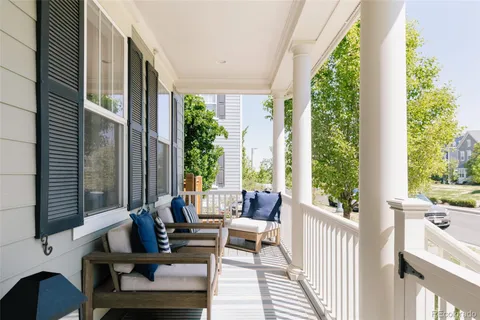 a building outdoor space with patio furniture and potted plants