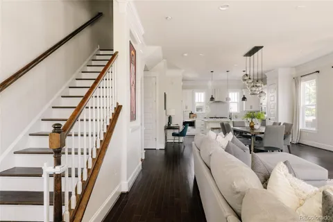a living room with furniture or wooden floor and a chandelier