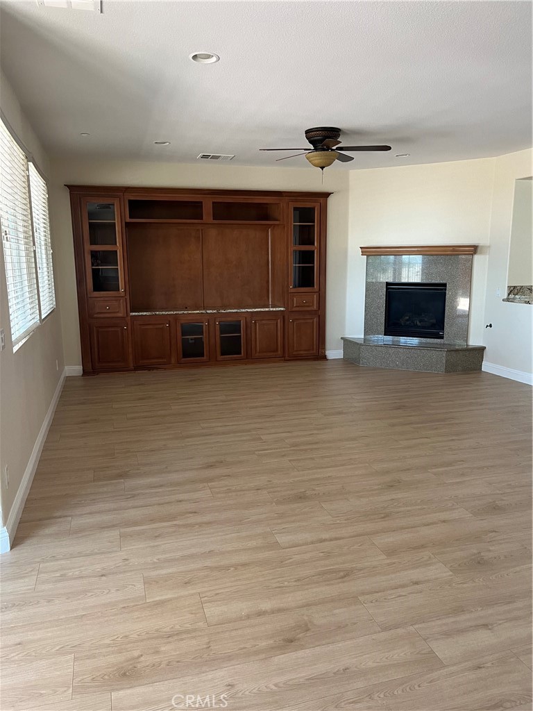 18388 Hidden Ranch Road Riverside, CA 92508 - Photo 44 of 46 a view of an empty room with a fireplace and a window