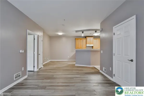 a view of a kitchen with a sink and a window