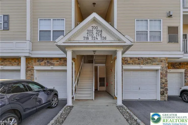 a view of a car park in front of house