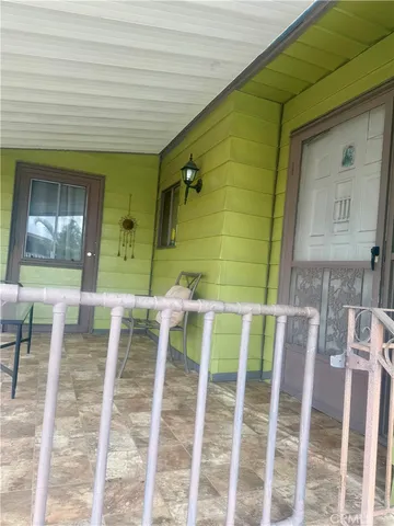 a front view of a house with outdoor seating