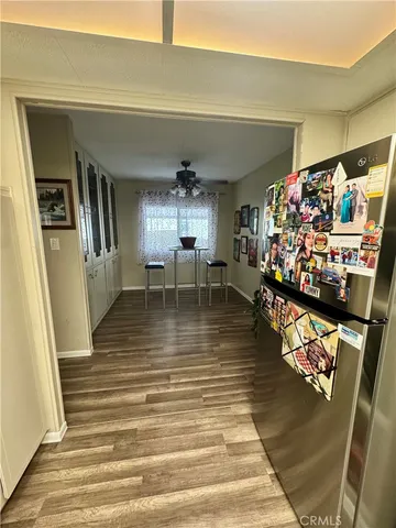 a view of a house with backyard and furniture