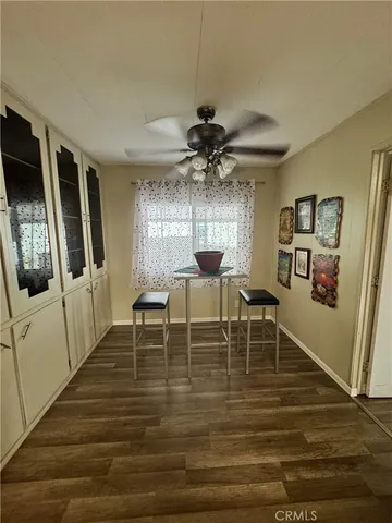 a view of a porch with furniture and a yard