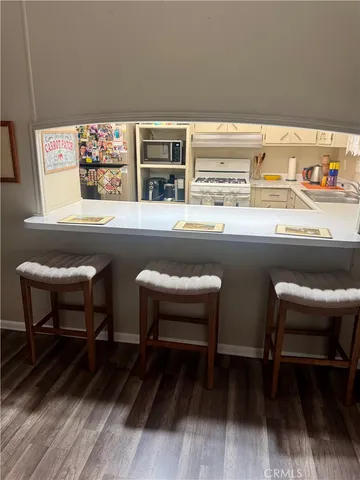 a bedroom with furniture and wooden floor