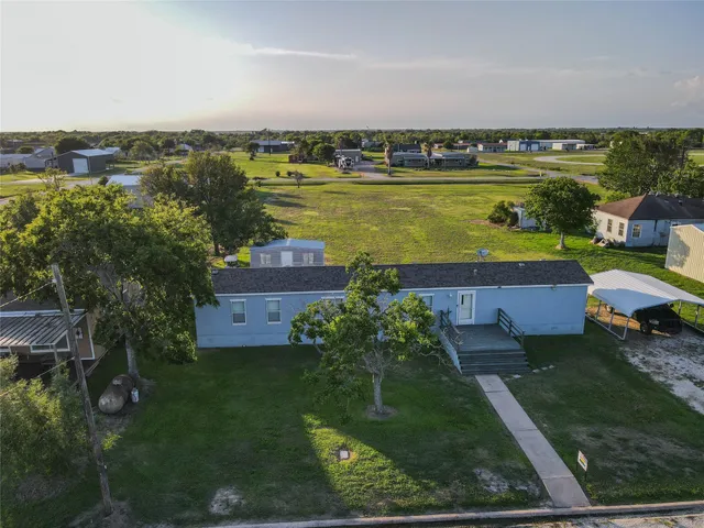 an aerial view of a house with a garden