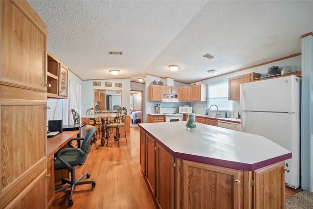 a kitchen with lots of counter top space and appliances