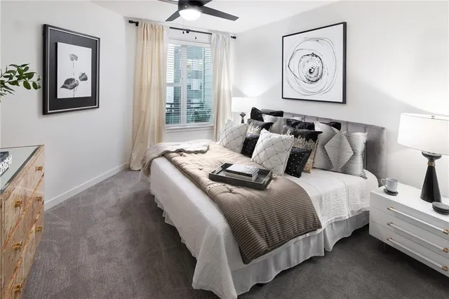 a bedroom with bed and a window