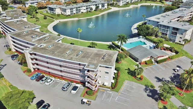 an aerial view of a house with a swimming pool