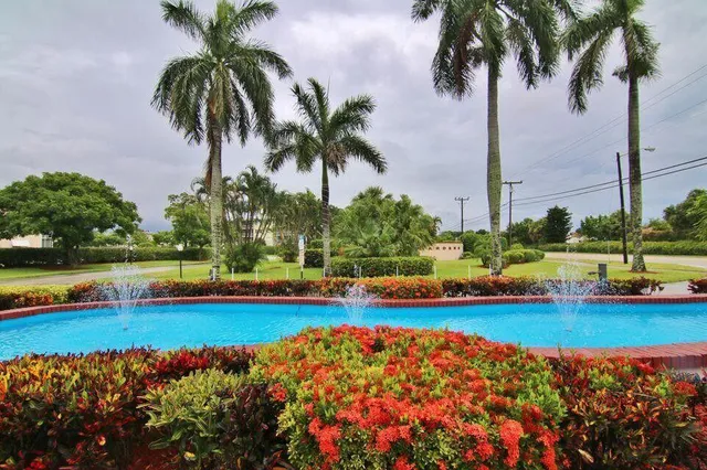 a view of swimming pool with a table and chairs