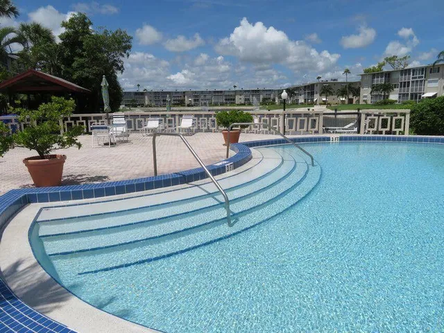 a view of a swimming pool with a patio