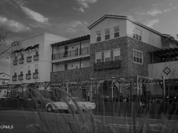 a front view of a house with parking