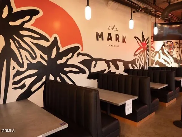 a kitchen with white cabinets a sink and a stove