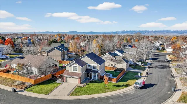 an aerial view of a house with a ocean view