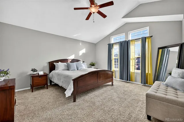 a bed room with a bed and a couch