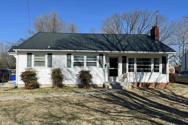 a front view of a house with yard