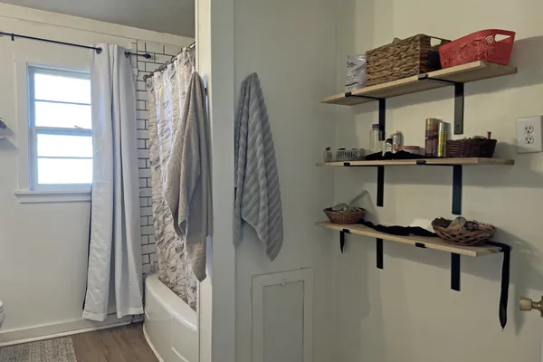 a kitchen with stainless steel appliances cabinets and a table