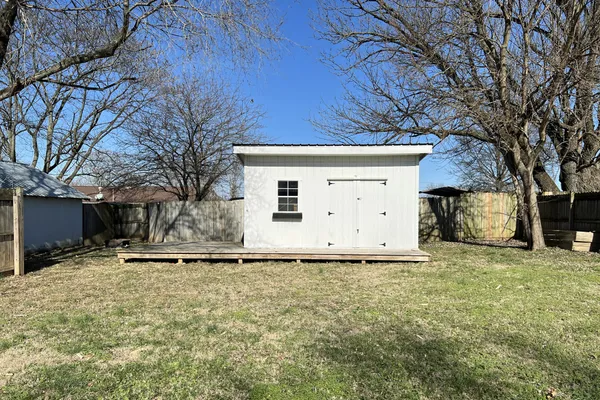a house with trees in the background