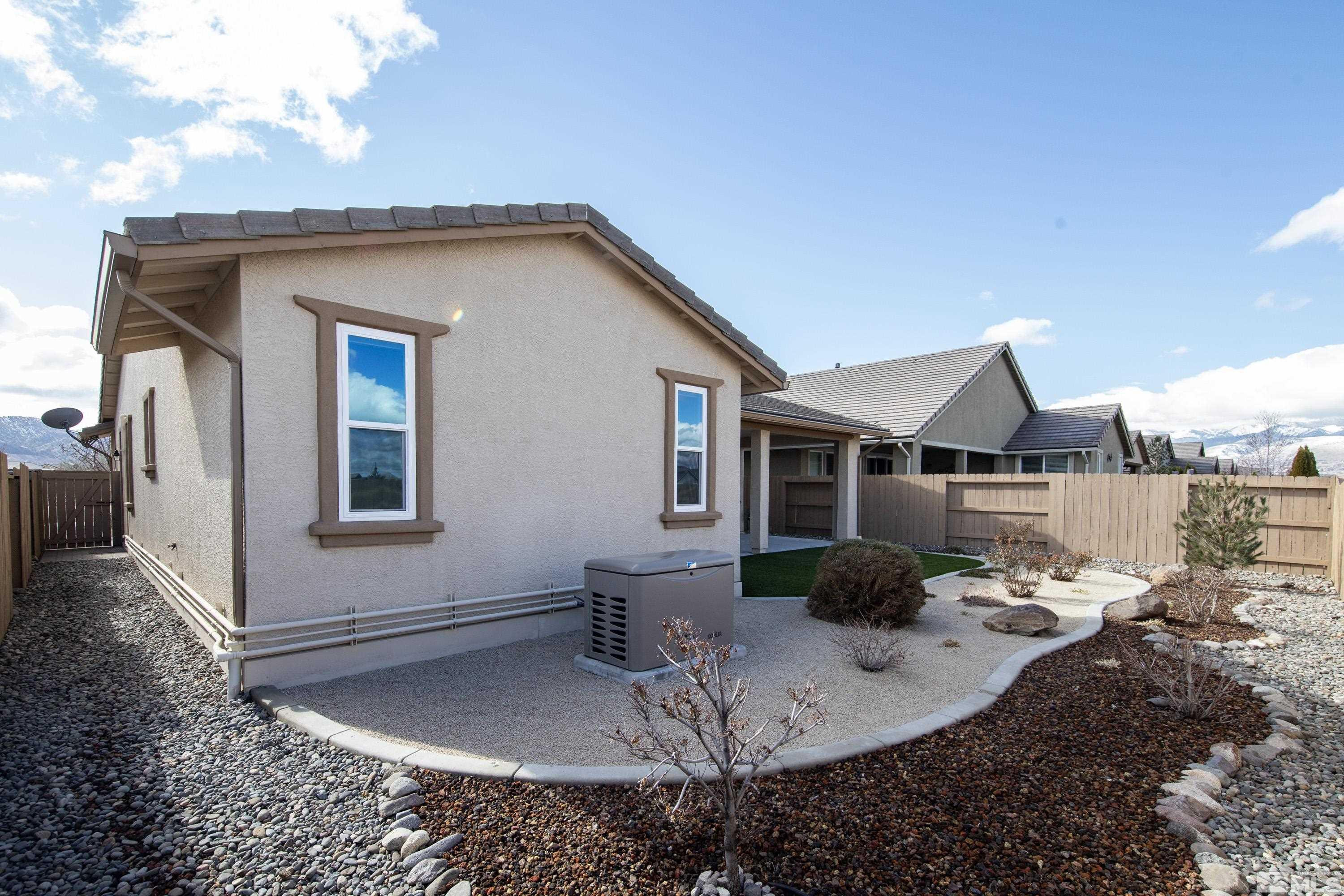 2345 Niatross Lane Reno, NV 89521 - Photo 31 of 40 a backyard of a house with yard barbeque oven and outdoor seating