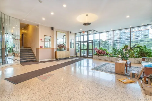 a view of a living room and a balcony