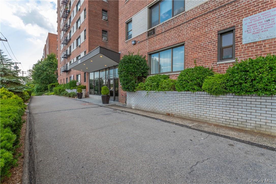 411 Bronx River Road, Unit 7F Yonkers, NY 10704 - Photo 23 of 23 a view of a street with a brick building