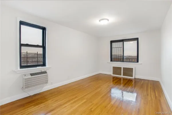 wooden floor and window in an empty room