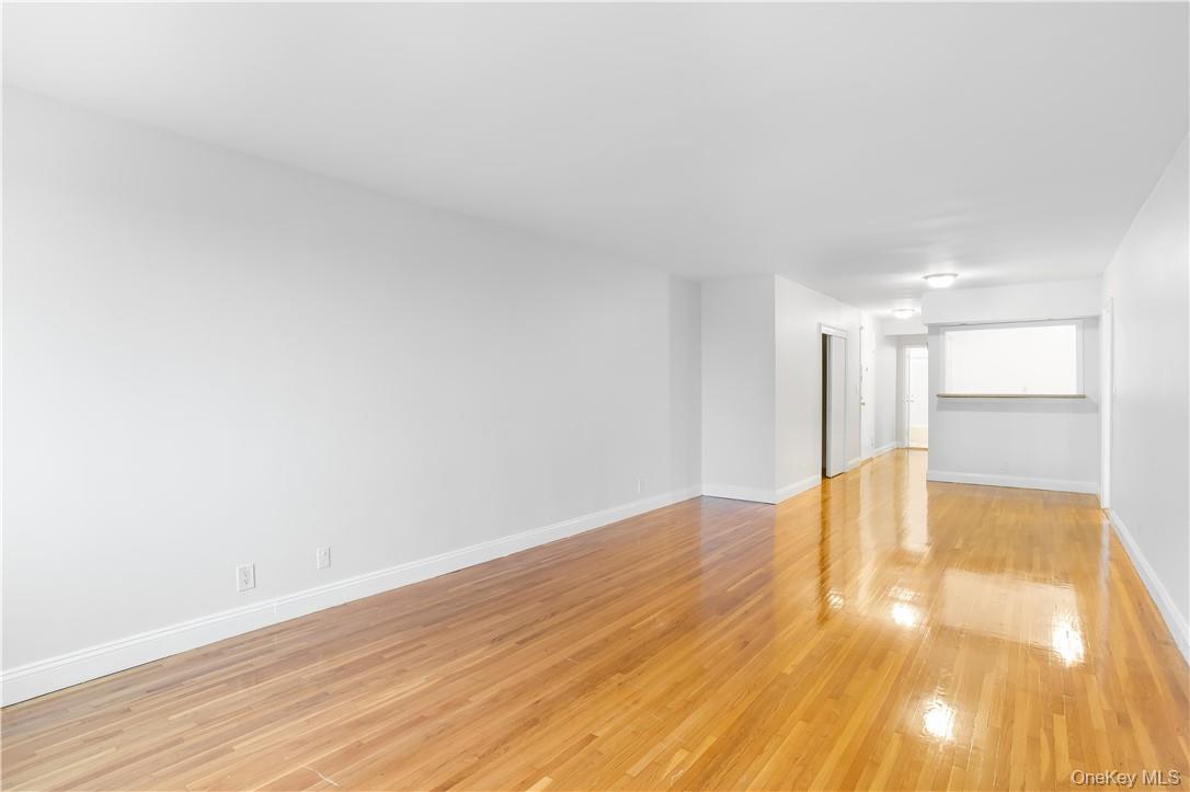 411 Bronx River Road, Unit 7F Yonkers, NY 10704 - Photo 10 of 23 a view of an empty room and wooden floor
