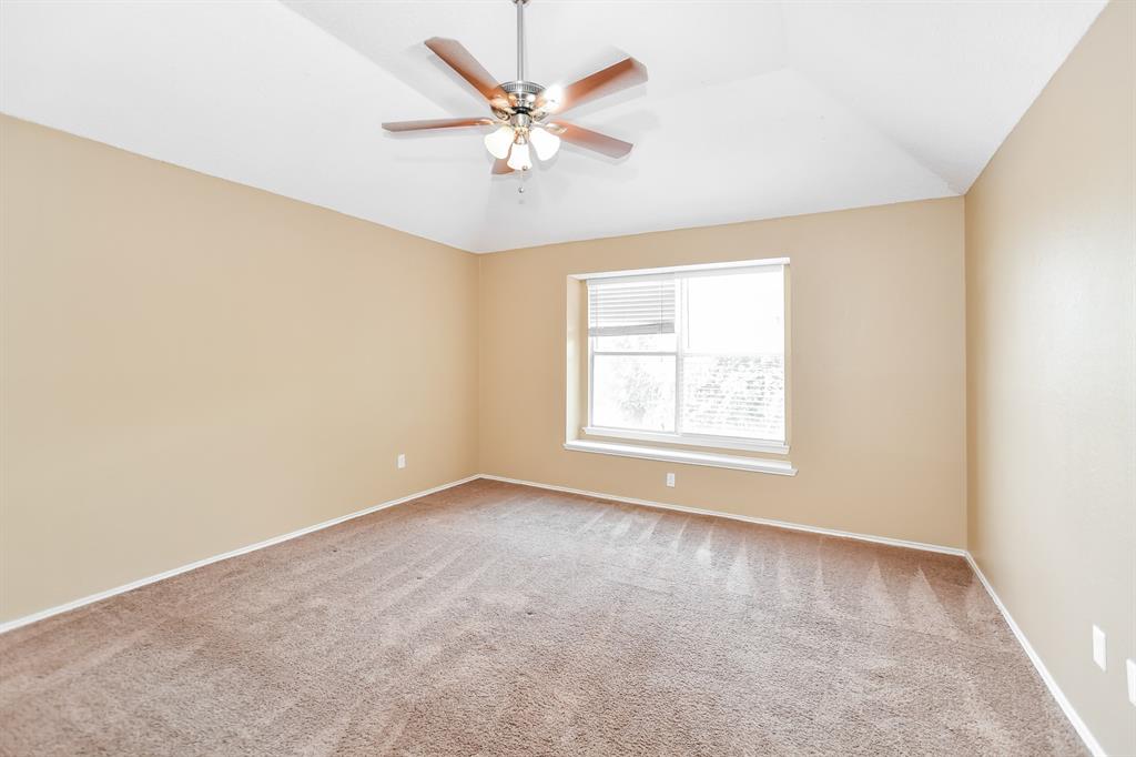 2425 Ithaca Drive Mesquite, TX 75181 - Photo 8 of 17 an empty room with a window and a fan