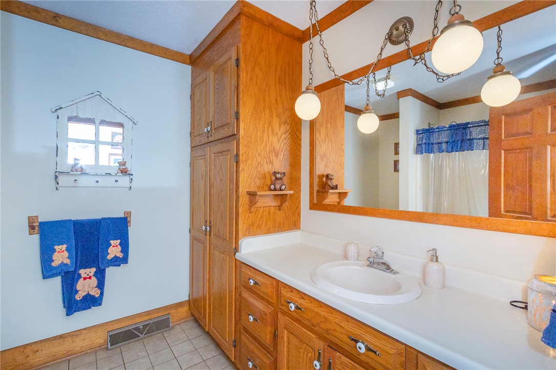 911 State Rd S-4-203 Belton, SC 29627 - Photo 21 of 49 Functional bathroom offering ample storage, a bright vanity, and integrated lighting.