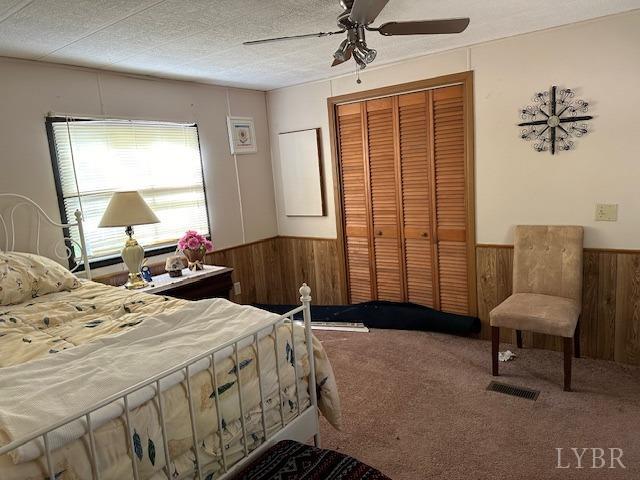 2319 West Perch Road Monroe, VA 24574 - Photo 9 of 50 a bedroom with a bed a couch and a dresser